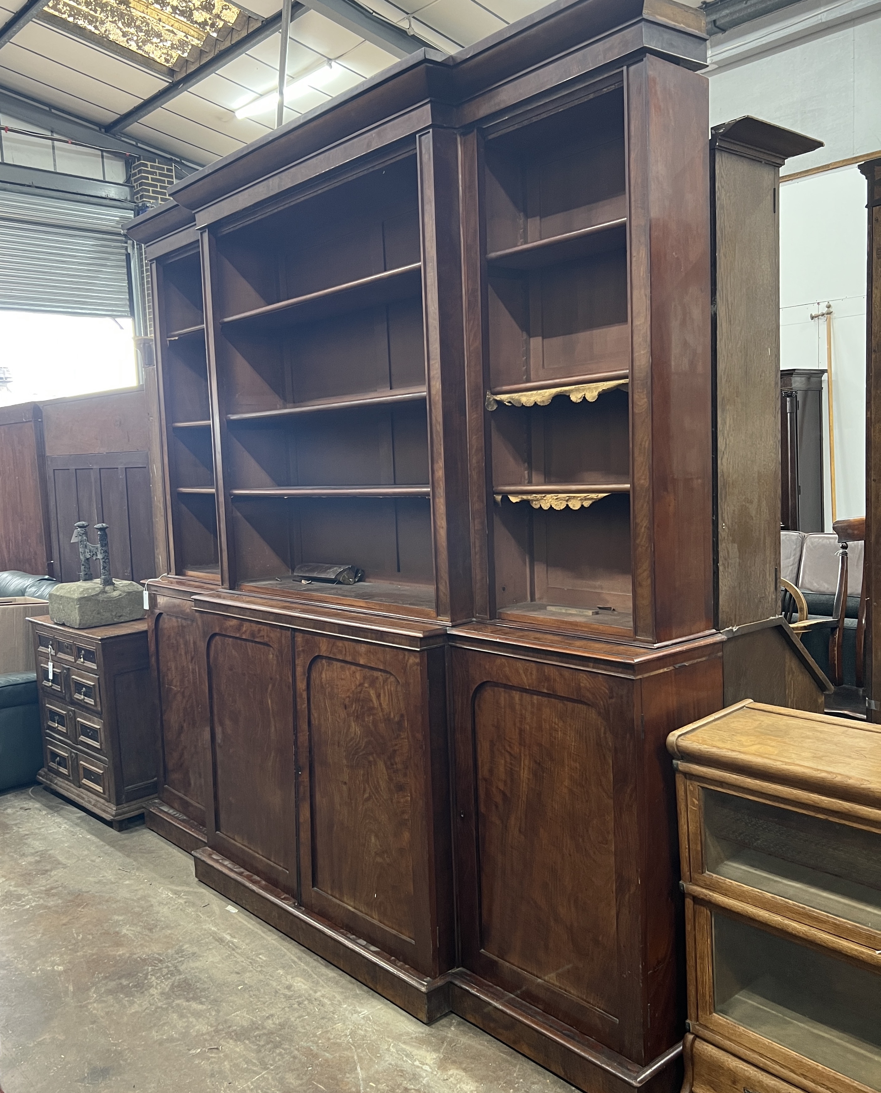 A George IV mahogany breakfront library bookcase, width 236cm, depth 42cm, height 227cm